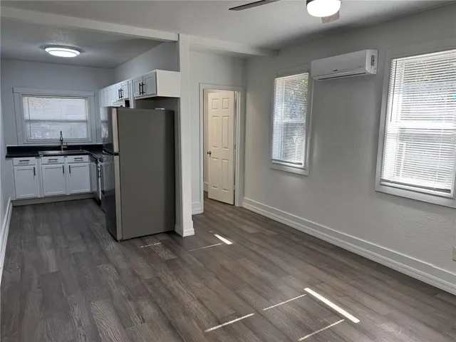 a view of a livingroom with a chandelier fan