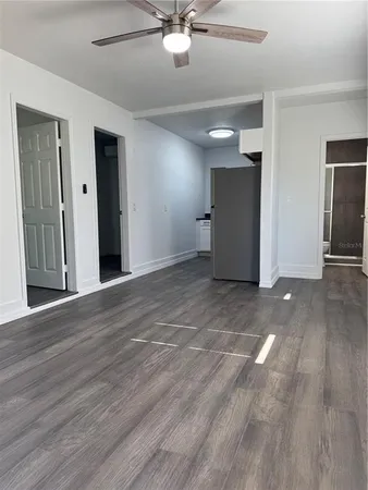 a bathroom with a shower a toilet and sink