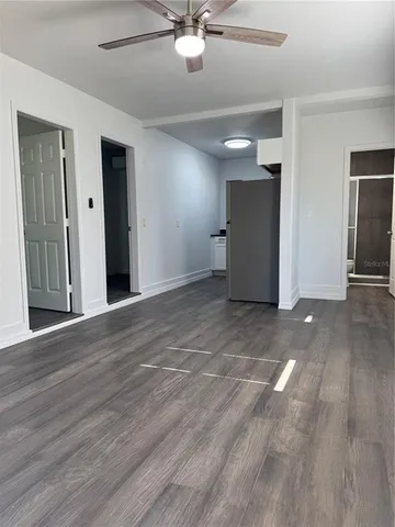 a bathroom with a shower a toilet and sink