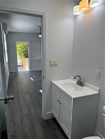 a kitchen with stainless steel appliances a stove a microwave and cabinets