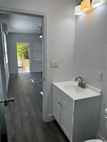 a kitchen with stainless steel appliances a stove a microwave and cabinets