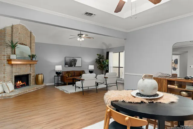 a living room with furniture and fireplace