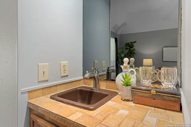 a kitchen with a sink and a counter top space