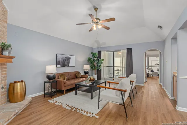 a living room with furniture and a window