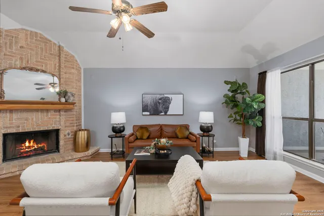 a living room with furniture and a fireplace