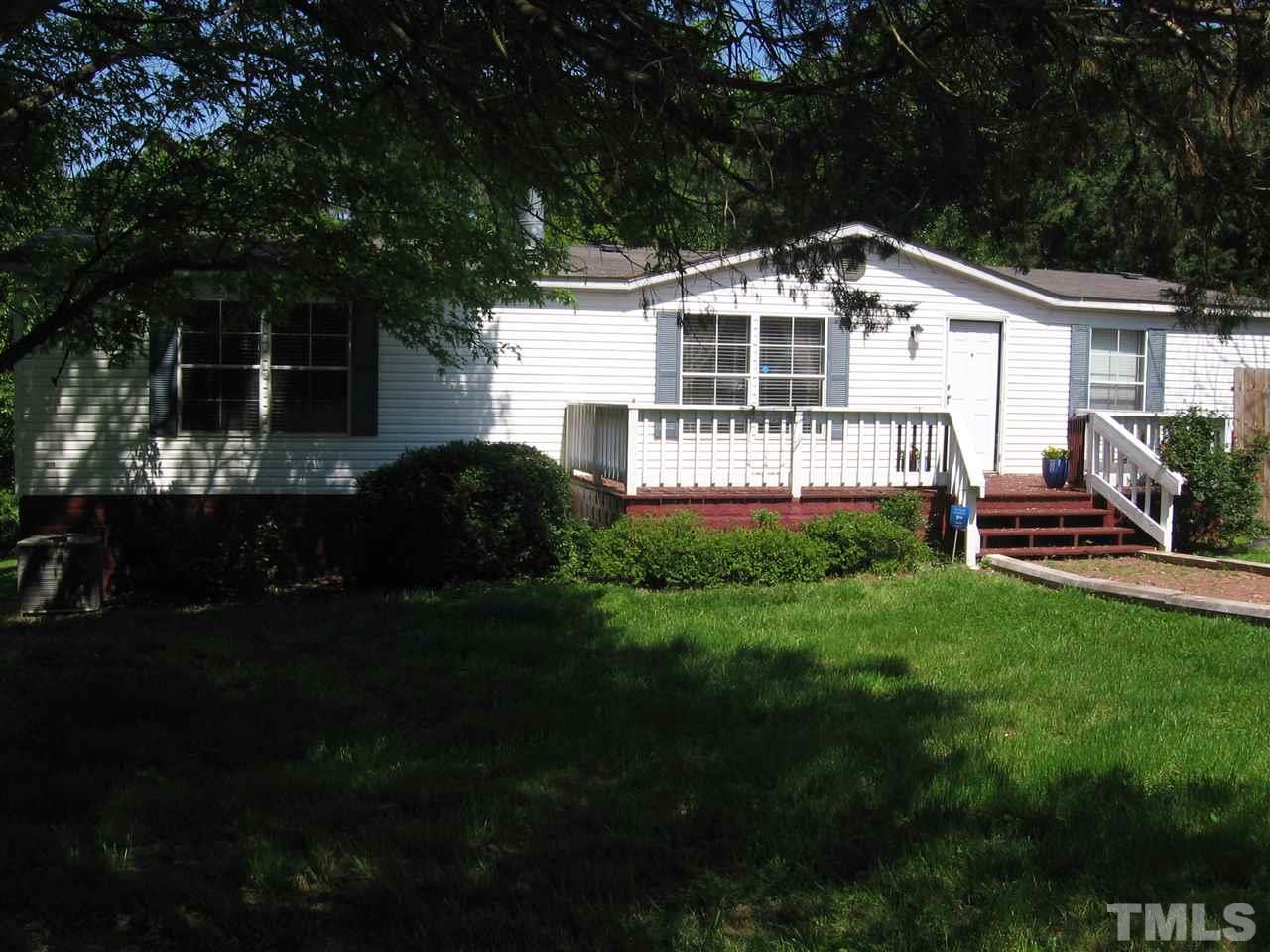 155 Charlie Fields Road Pittsboro, NC 27312 - Photo 2 of 25 triplewide made 7/28/93. Bought from dealer, permits, moved & set up in 1994. 2 parking pads fits 4 vehicles & parking on quiet street allowed.