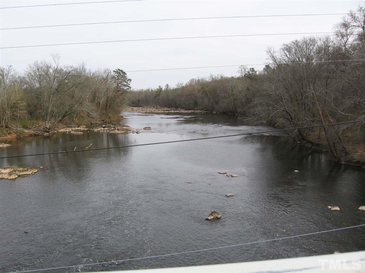 155 Charlie Fields Road Pittsboro, NC 27312 - Photo 24 of 25 Haw River to the left of the old bridge. Canoe, kayak, etc goes on all the time here.