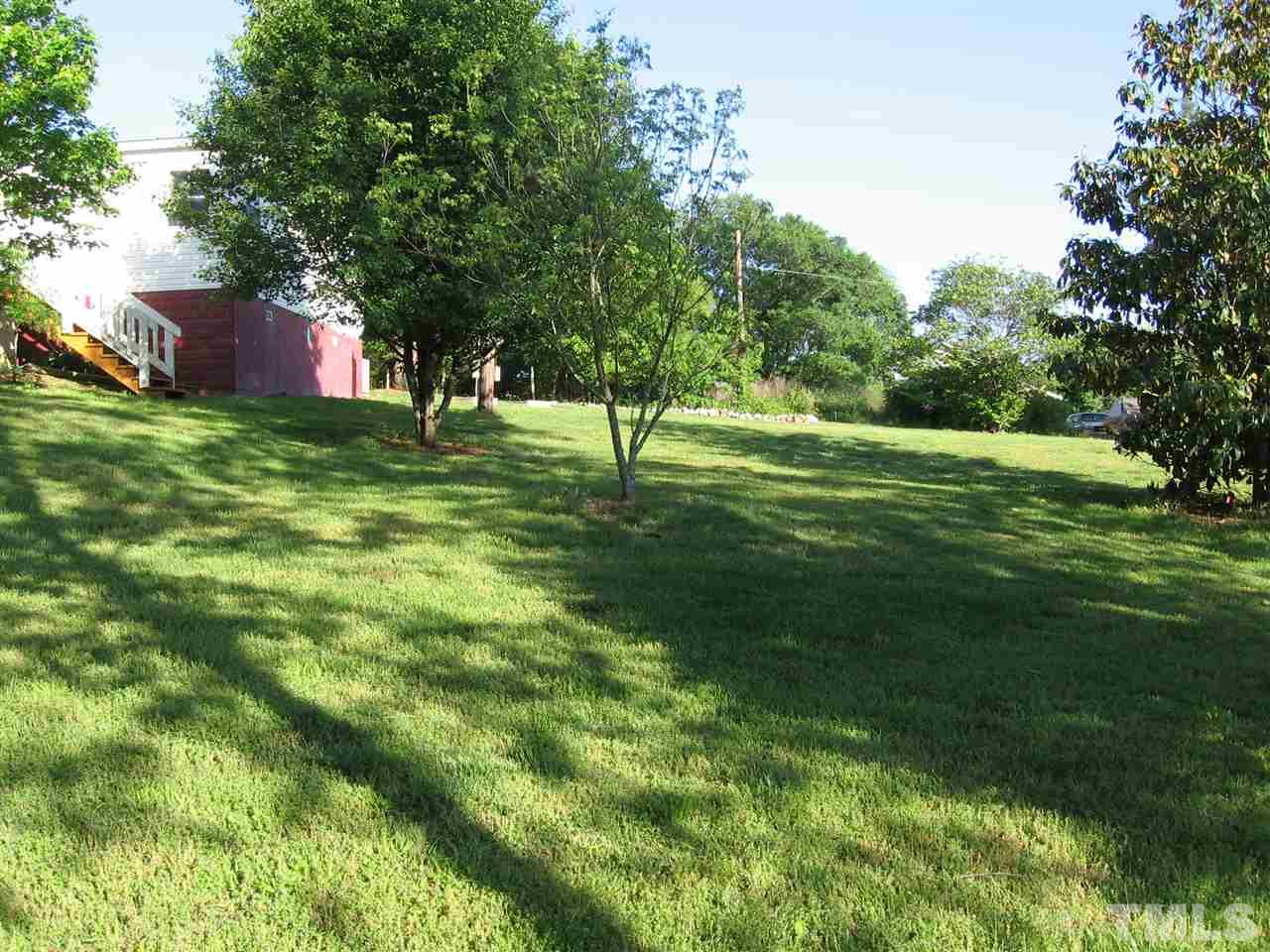 155 Charlie Fields Road Pittsboro, NC 27312 - Photo 4 of 25 Large side yard. Plenty of full sun side & back for garden.