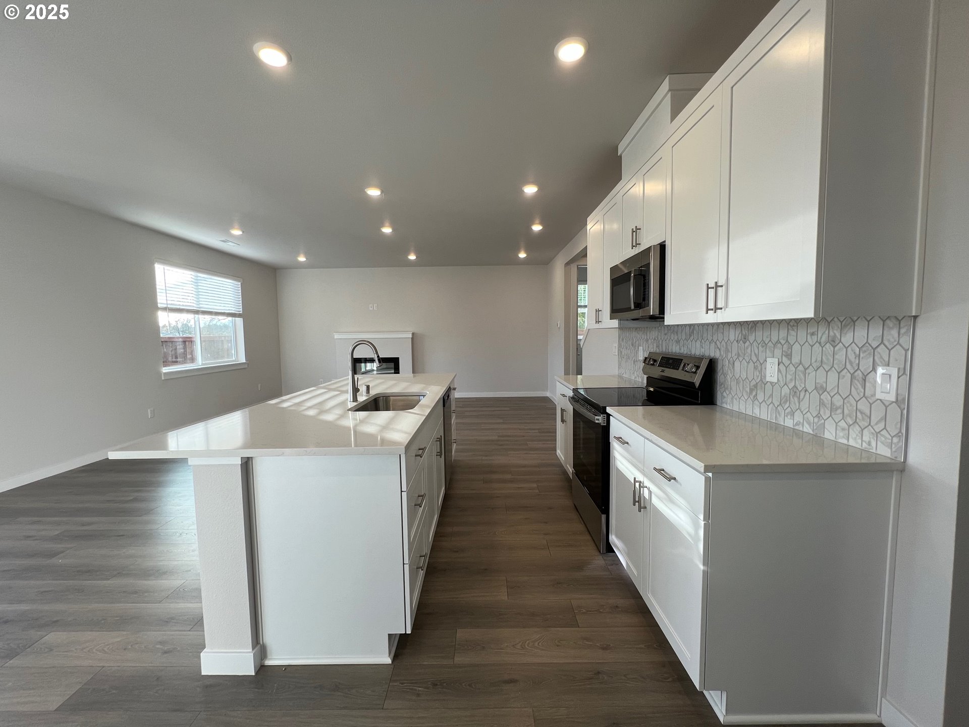 1001 Southwest 30th Street Battle Ground, WA 98604 - Photo 12 of 29 a kitchen with kitchen island sink stove and refrigerator