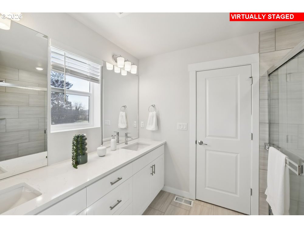 1001 Southwest 30th Street Battle Ground, WA 98604 - Photo 17 of 29 a bathroom with a double vanity sink and mirror