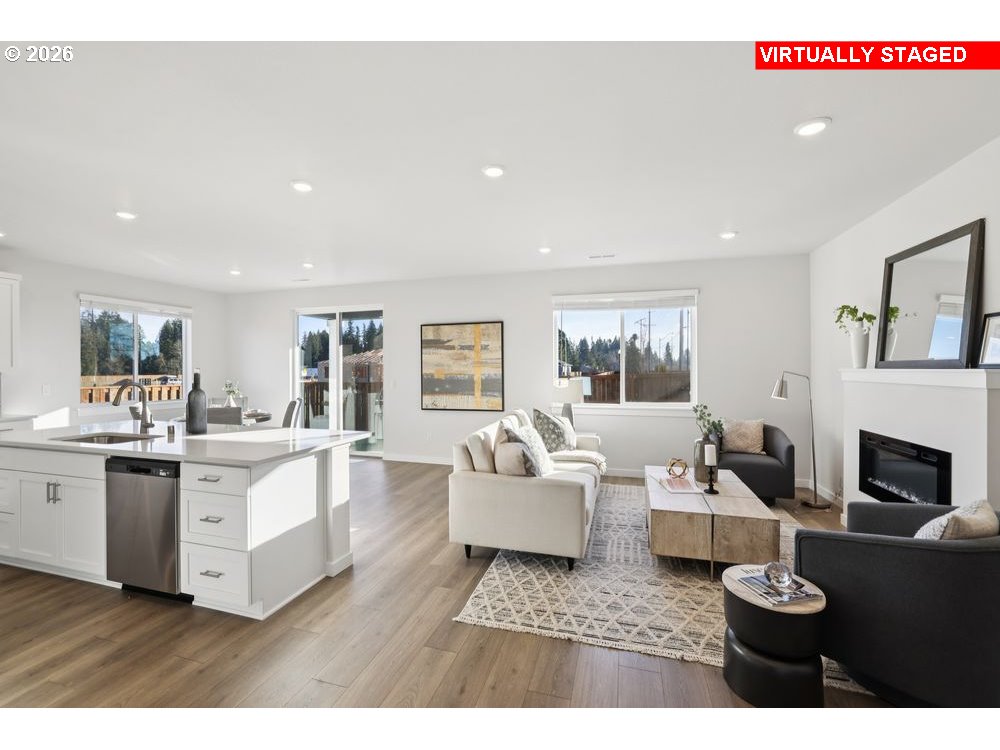 1001 Southwest 30th Street Battle Ground, WA 98604 - Photo 24 of 29 a living room with furniture a fireplace and a flat screen tv