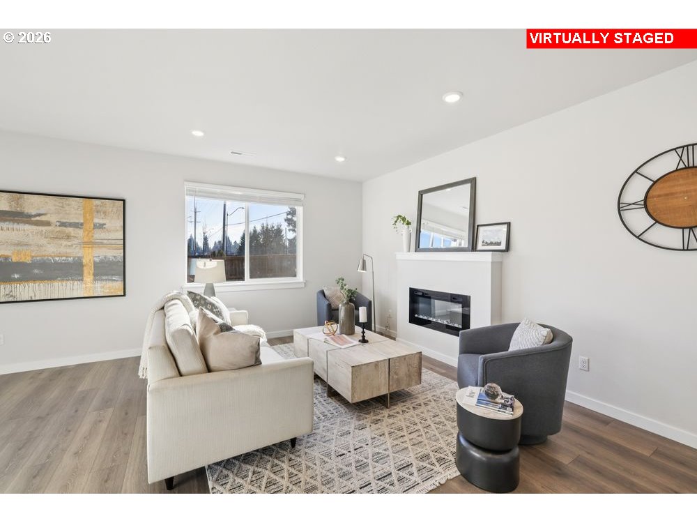 1001 Southwest 30th Street Battle Ground, WA 98604 - Photo 28 of 29 a living room with furniture and a fireplace
