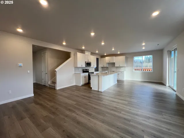 a view of kitchen with wooden floor