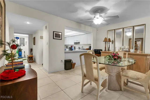 a dining room with furniture and window