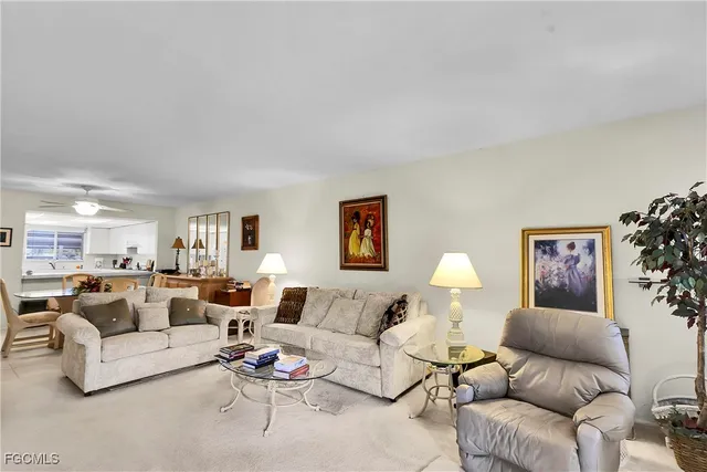 a living room with furniture and a night stand