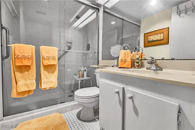 a bathroom with a sink toilet and mirror