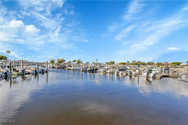a view of outdoor space with swimming pool and trees in the background