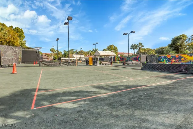 a view of a house with a yard and trees