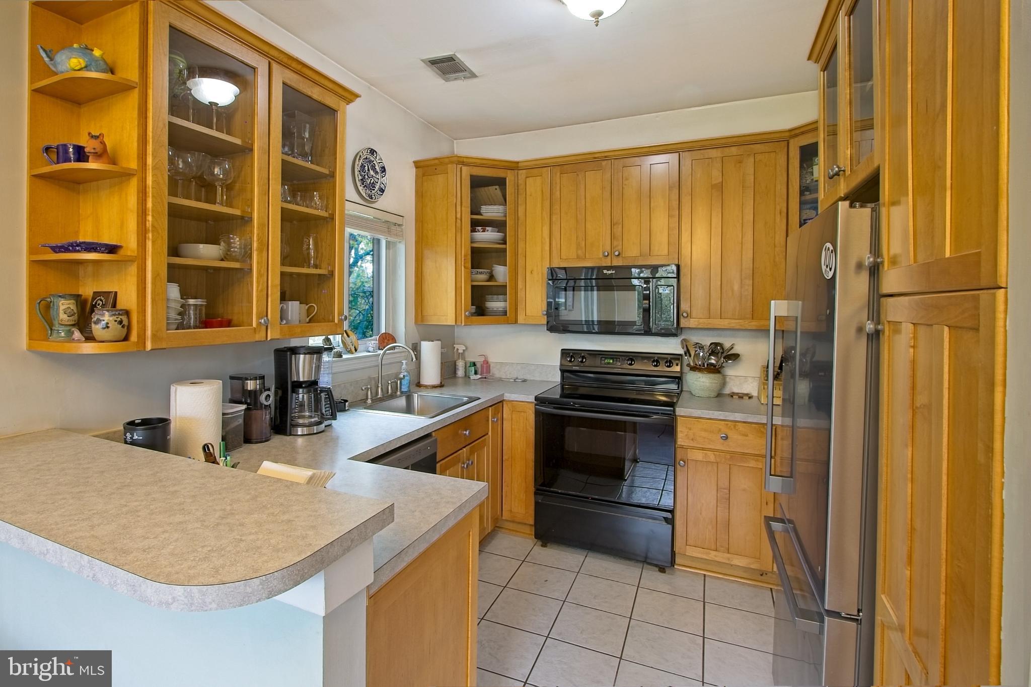 11045 Villaridge Court Reston, VA 20191 - Photo 14 of 38 42" wood cabinets and ceramic tile flooring