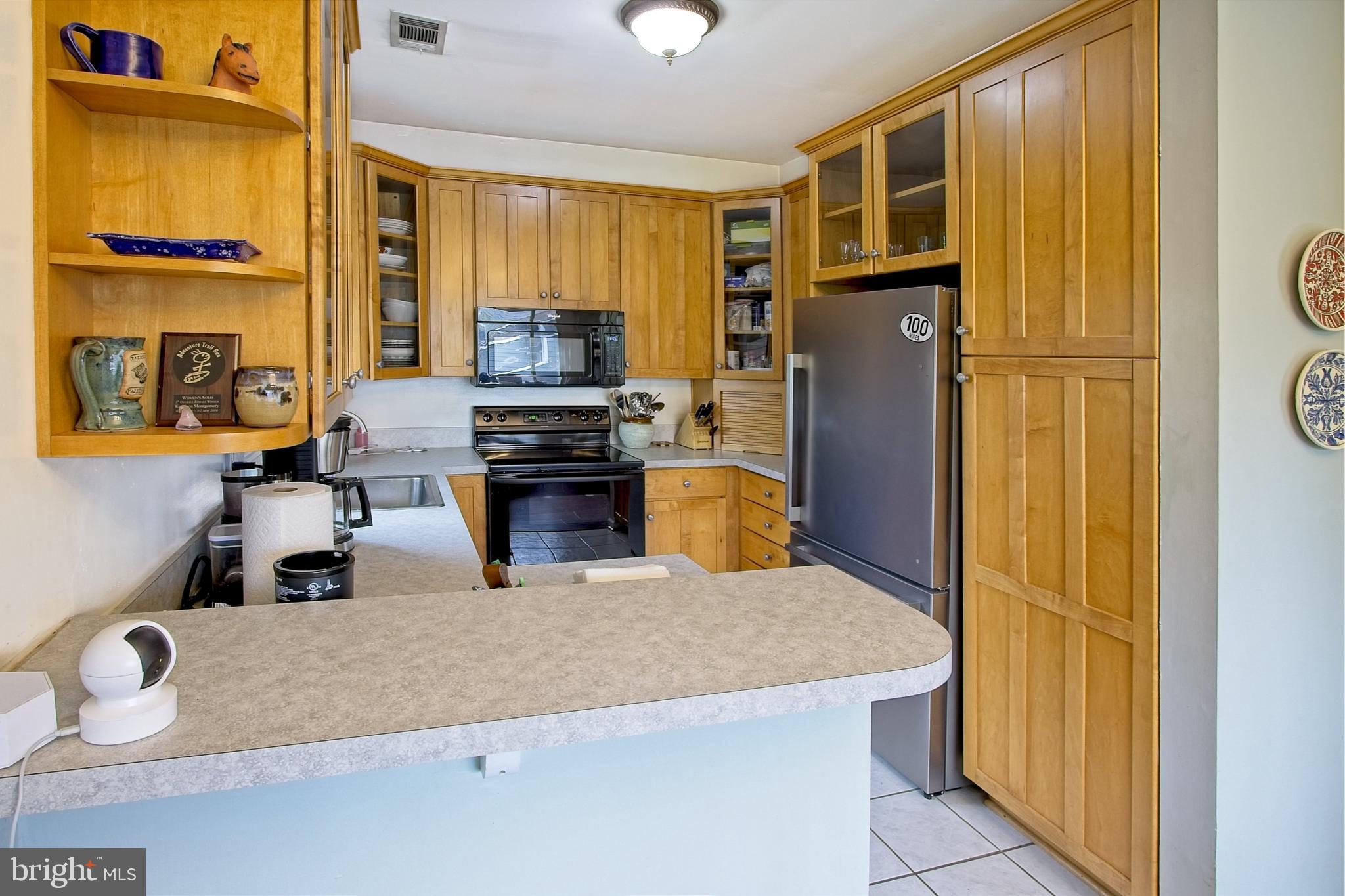 11045 Villaridge Court Reston, VA 20191 - Photo 15 of 38 Stainless refrigerator dishwasher and pantry