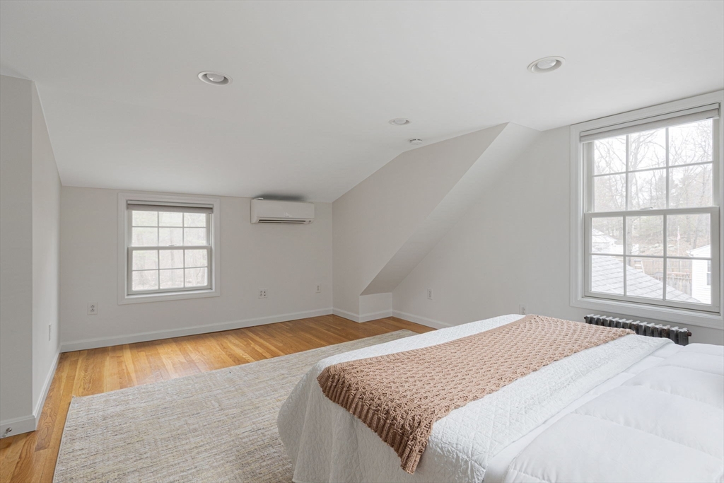 42 Swain Road Wilmington, MA 01887 - Photo 13 of 28 a bedroom with a bed and a large window