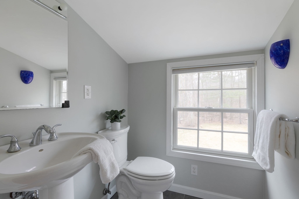 42 Swain Road Wilmington, MA 01887 - Photo 18 of 28 a bathroom with a sink and a toilet