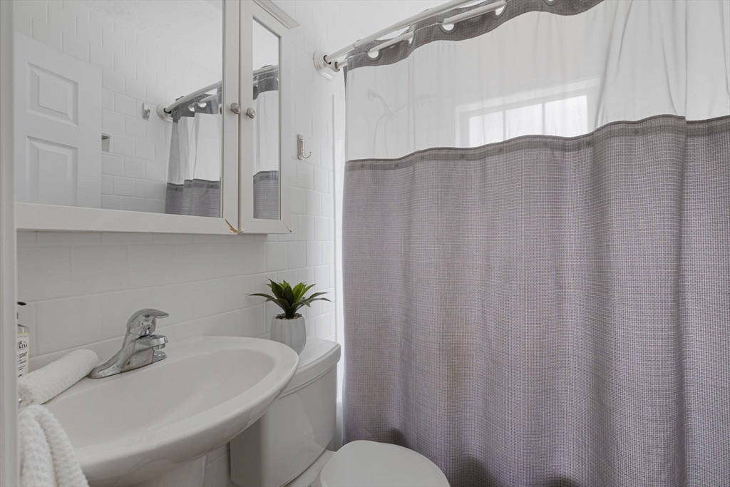 42 Swain Road Wilmington, MA 01887 - Photo 19 of 28 a bathroom with a sink and a mirror
