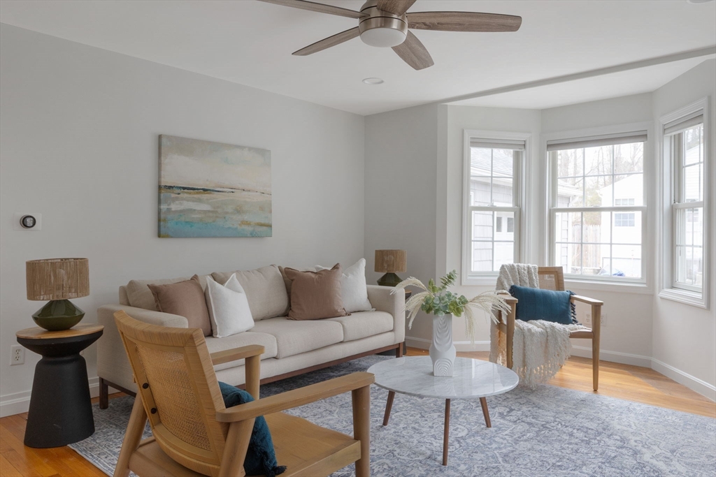 42 Swain Road Wilmington, MA 01887 - Photo 2 of 28 a living room with furniture and a potted plant