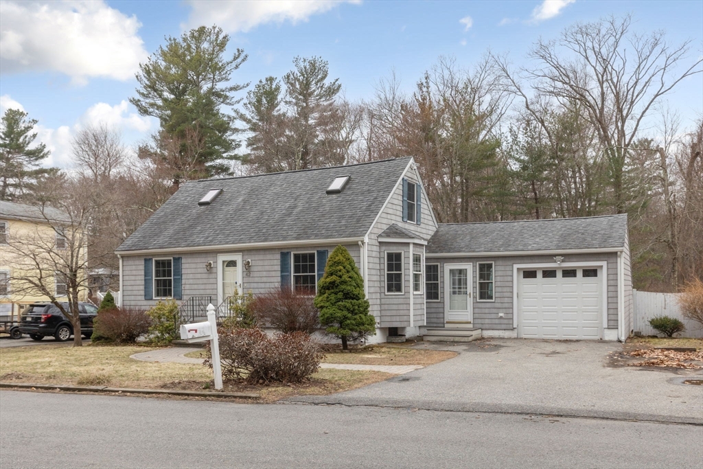 42 Swain Road Wilmington, MA 01887 - Photo 28 of 28 a front view of a house with a yard and garage