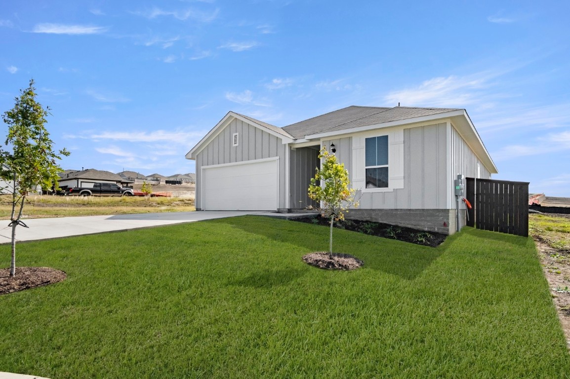 5409 Murano Cove Austin, TX 78747 - Photo 3 of 32 a front view of house with a garden and deck