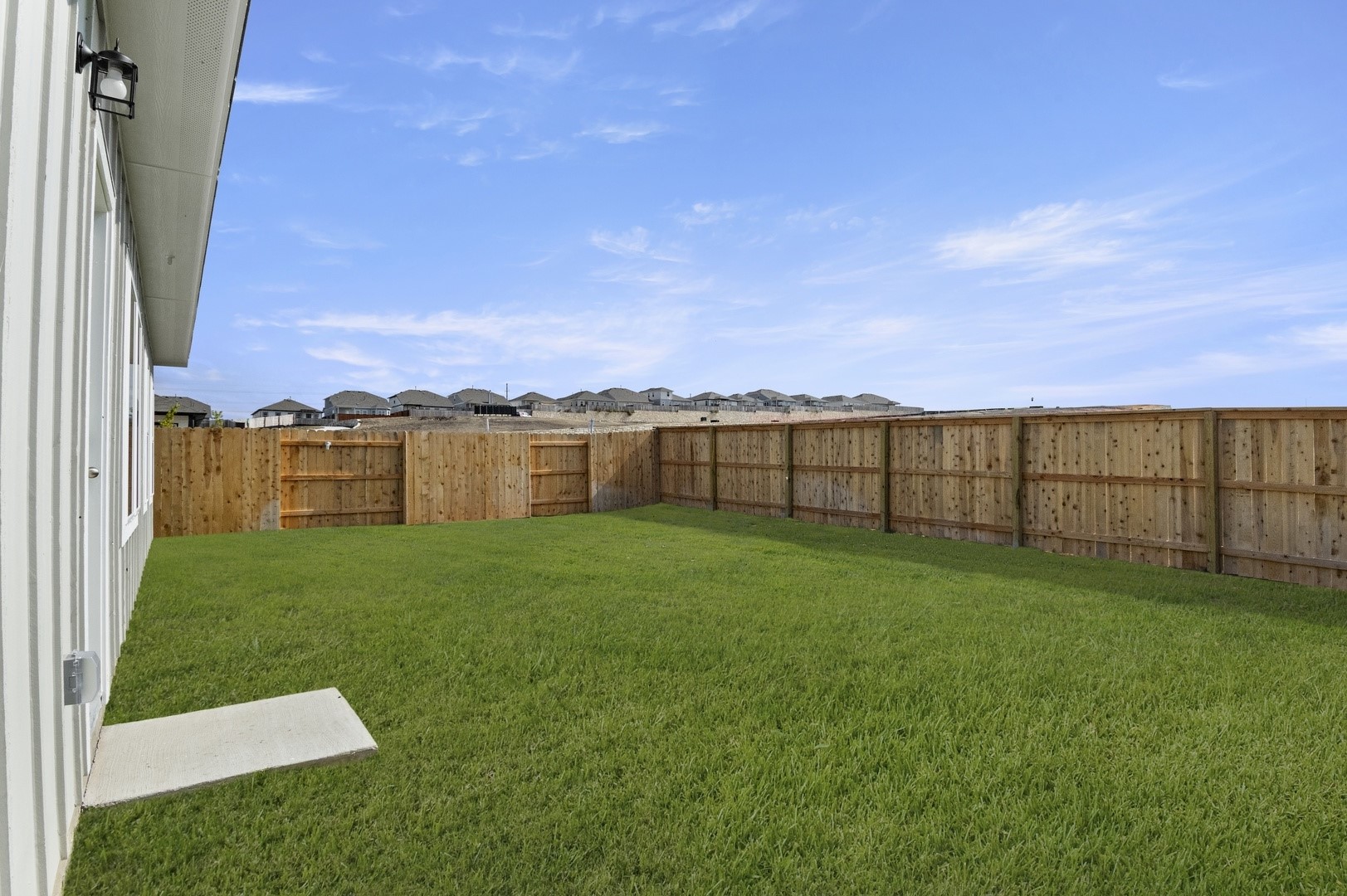 5409 Murano Cove Austin, TX 78747 - Photo 31 of 32 a view of a garden with a building in the background