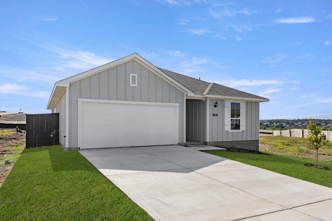 5409 Murano Cove Austin, TX 78747 - Photo 4 of 32 a front view of house with yard and garage