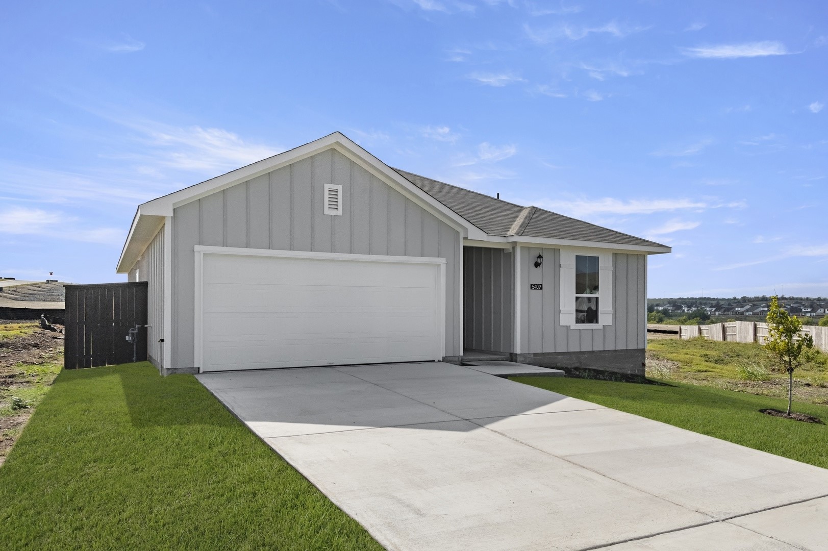5409 Murano Cove Austin, TX 78747 - Photo 4 of 32 a front view of house with yard and garage