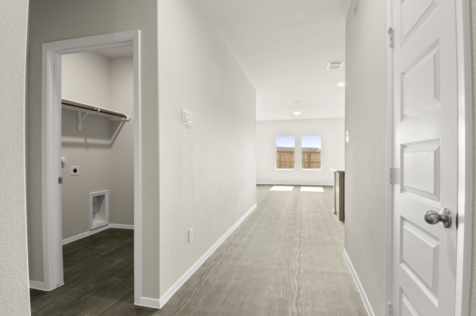 5409 Murano Cove Austin, TX 78747 - Photo 7 of 32 a view of a hallway with wooden floor and closet area