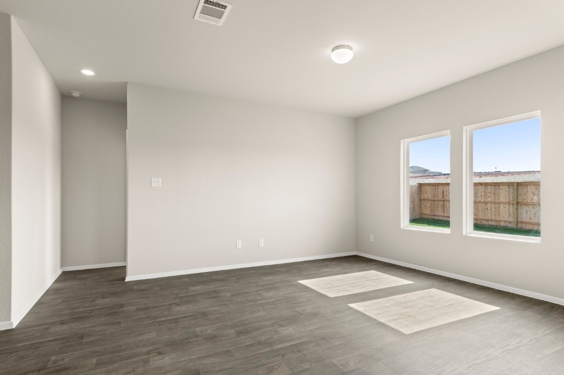 5409 Murano Cove Austin, TX 78747 - Photo 9 of 32 an empty room with a empty space and windows