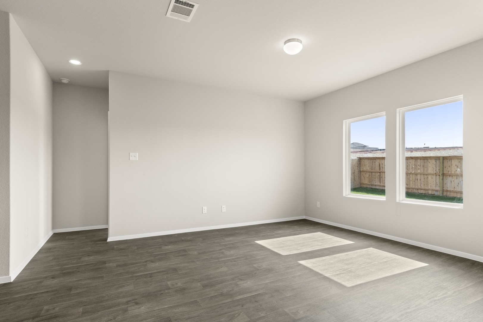 5409 Murano Cove Austin, TX 78747 - Photo 9 of 32 an empty room with a empty space and windows