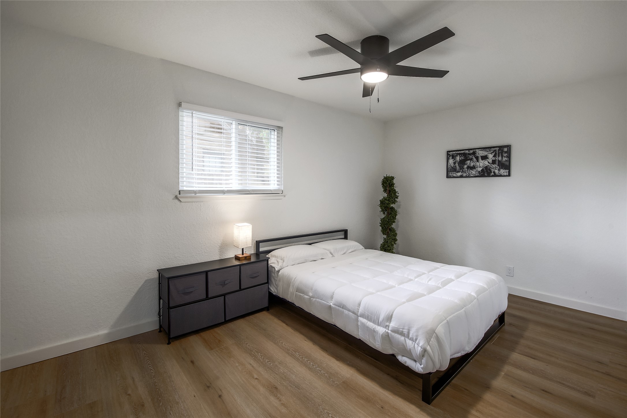 10509 Macmora Road, Unit B Austin, TX 78758 - Photo 13 of 19 a bedroom with a bed and window