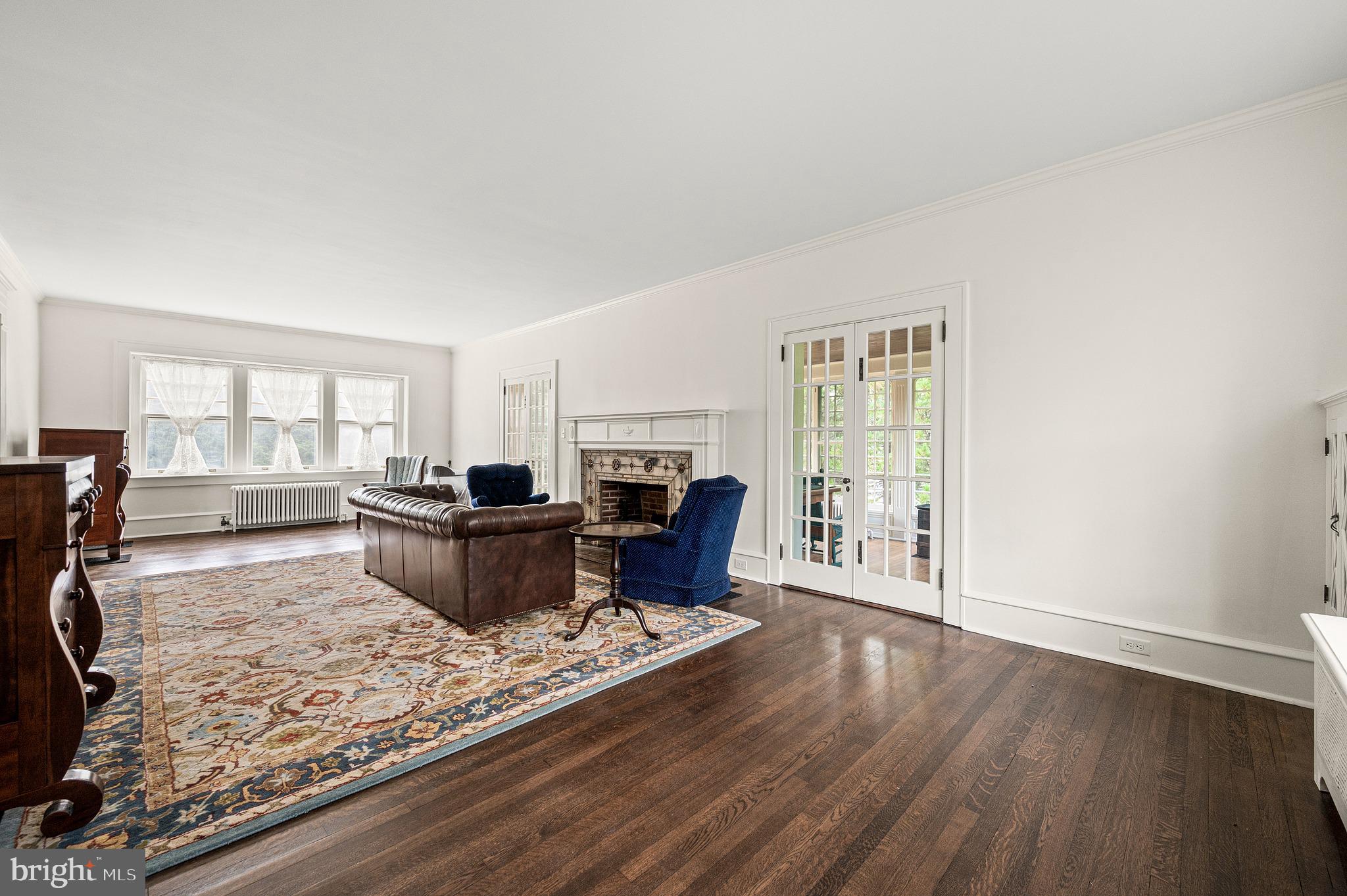 400 South Chester Road Swarthmore, PA 19081 - Photo 10 of 66 Elegant forma living room with a fireplace.