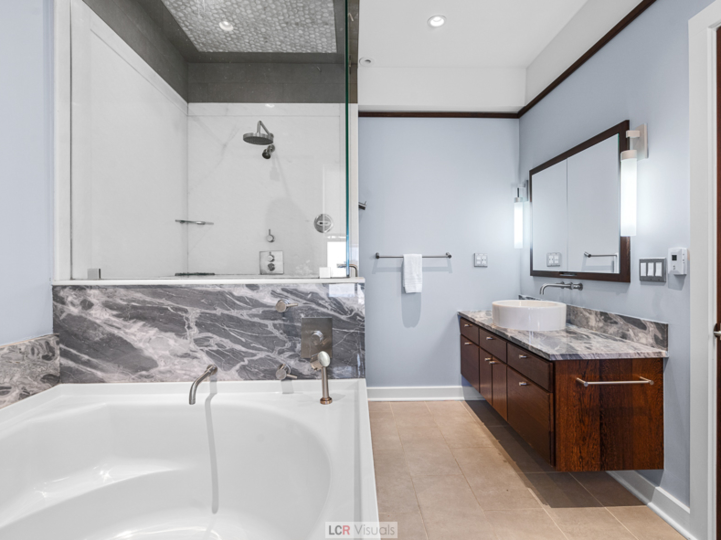 1012 Chicago Avenue Oak Park, IL 60302 - Photo 14 of 27 a spacious bathroom with a granite countertop sink a mirror and shower