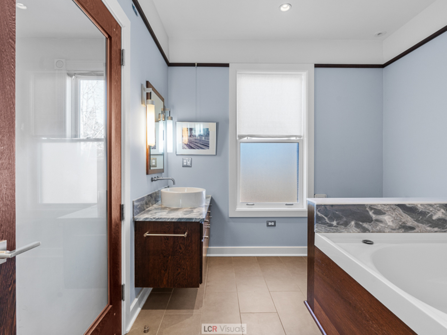 1012 Chicago Avenue Oak Park, IL 60302 - Photo 15 of 27 a bathroom with a granite countertop sink and mirror with bathtub