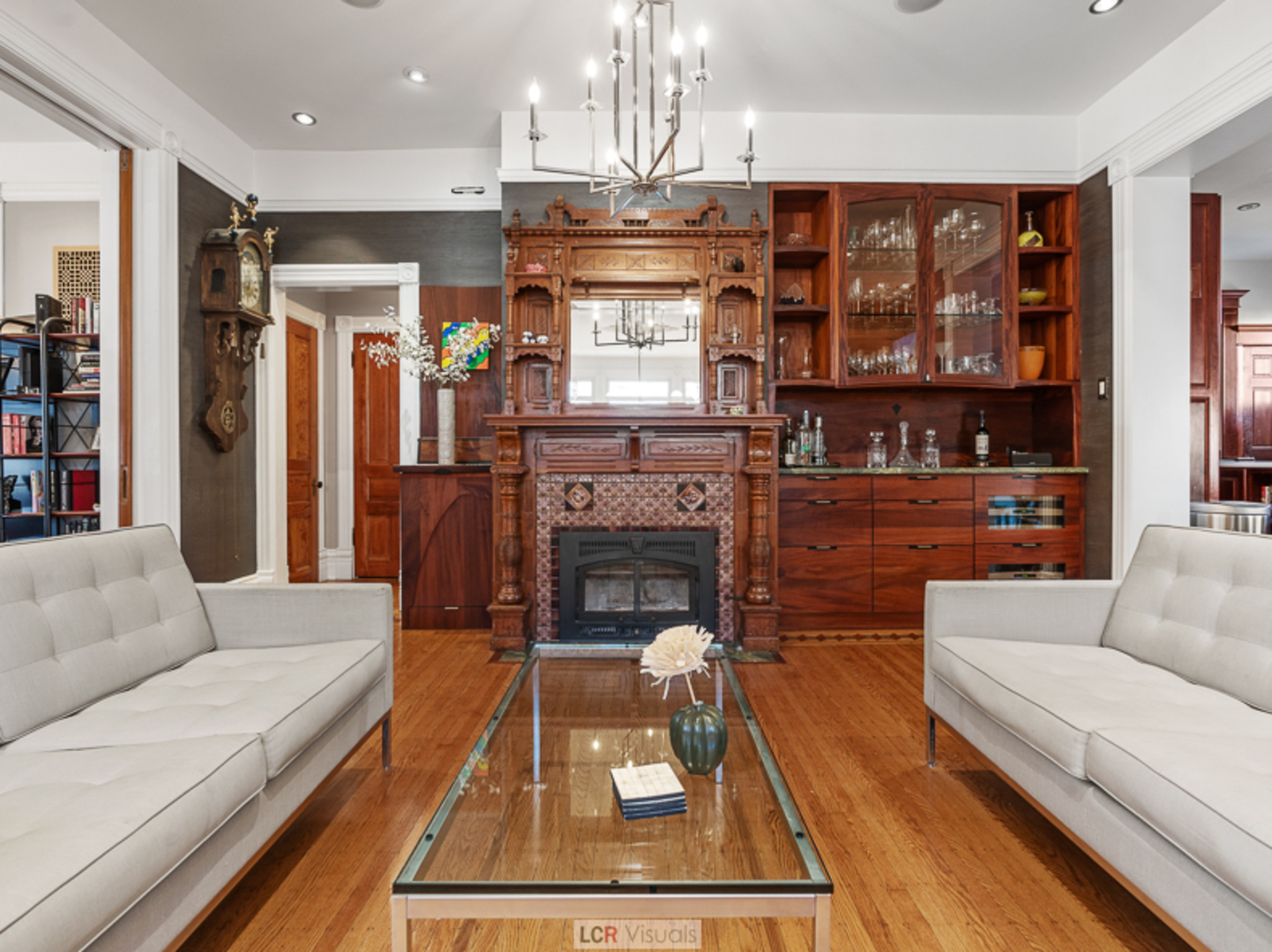 1012 Chicago Avenue Oak Park, IL 60302 - Photo 4 of 27 a living room with furniture a flat screen tv and a fireplace