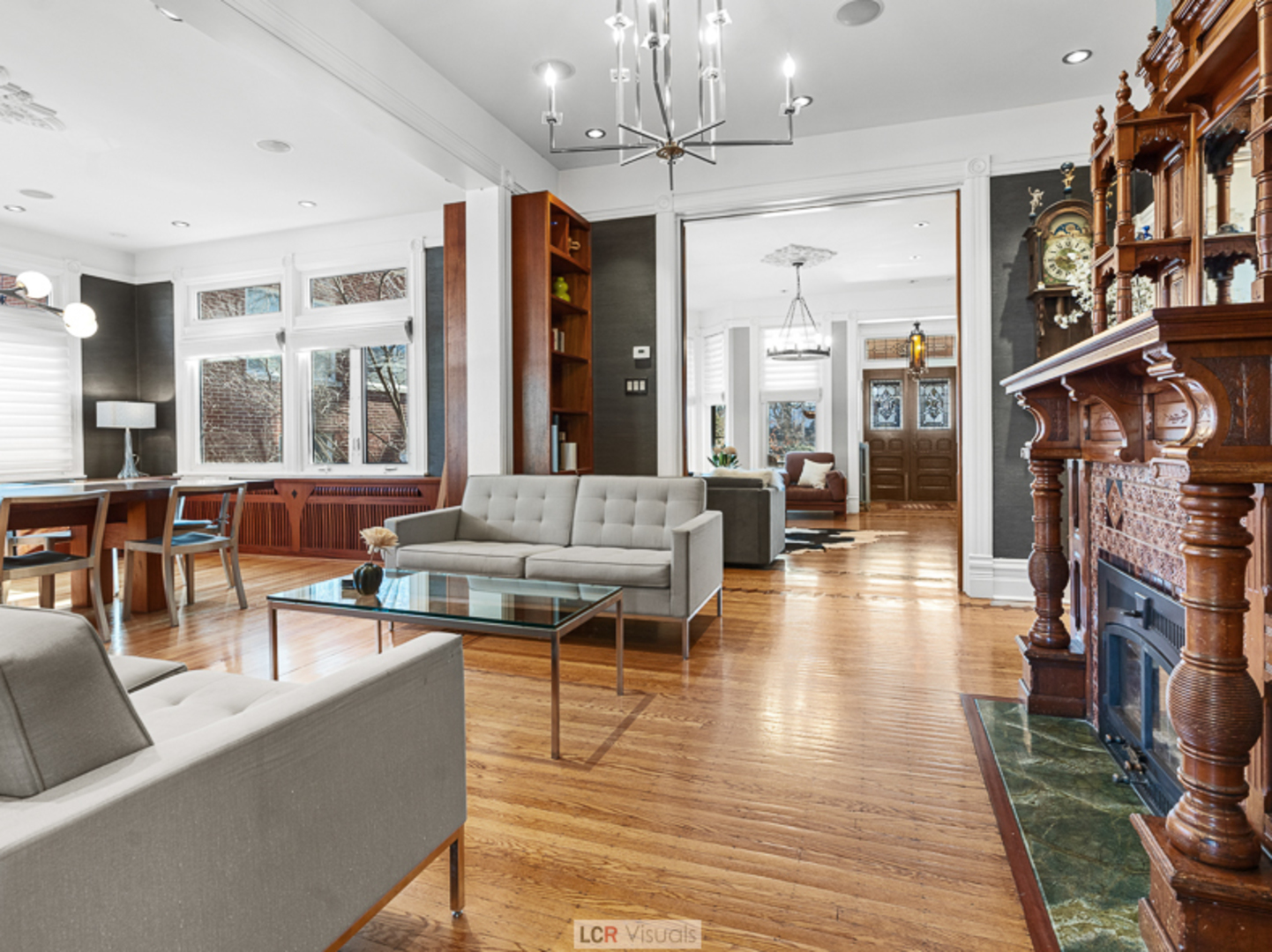 1012 Chicago Avenue Oak Park, IL 60302 - Photo 5 of 27 a living room with fireplace furniture and a chandelier