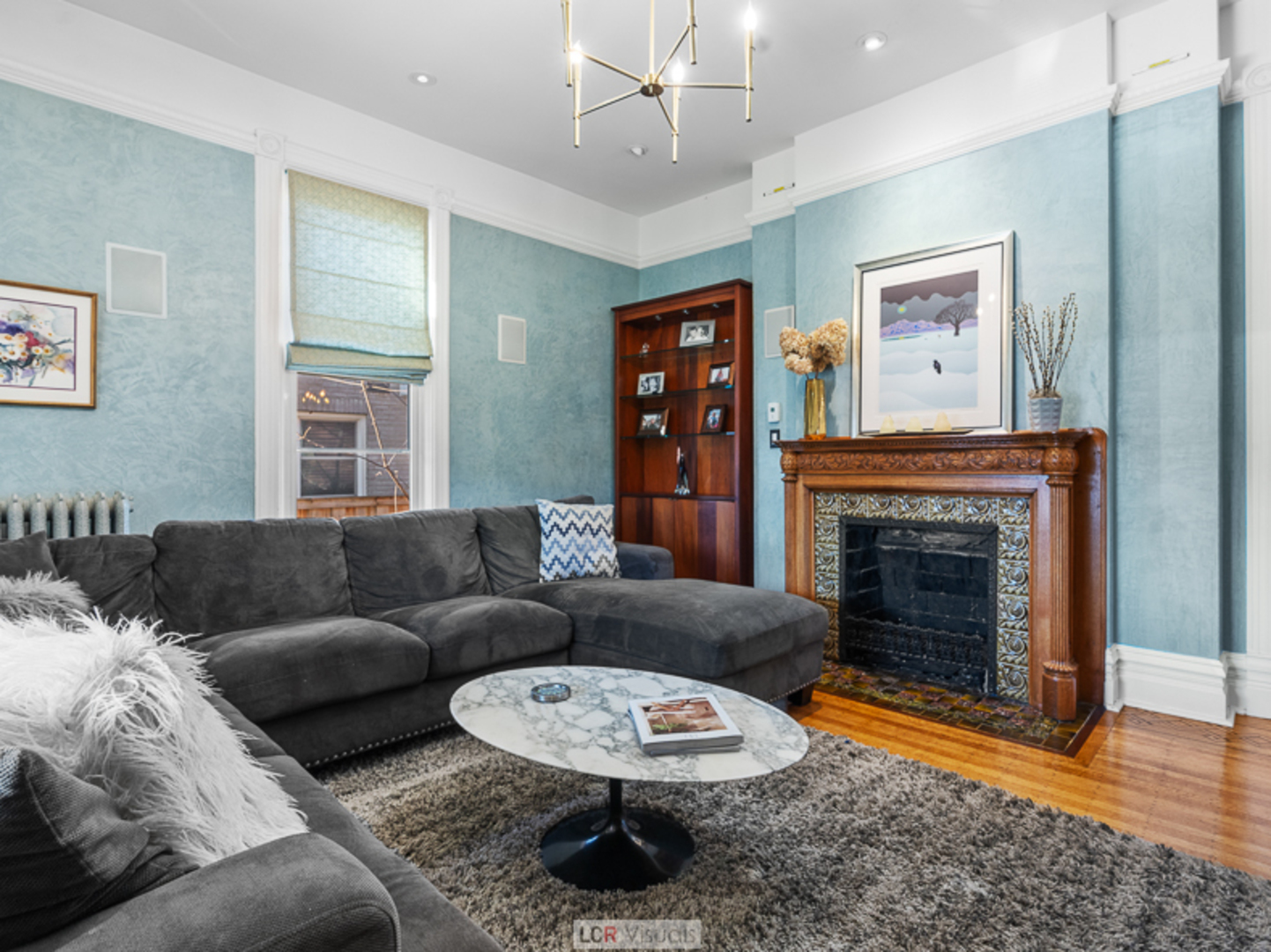 1012 Chicago Avenue Oak Park, IL 60302 - Photo 9 of 27 a living room with furniture and a fireplace