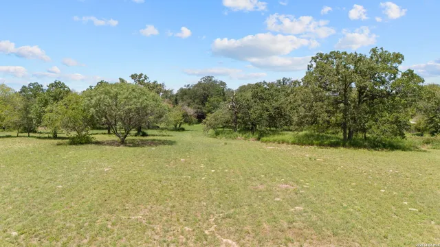 a view of a lake with a yard