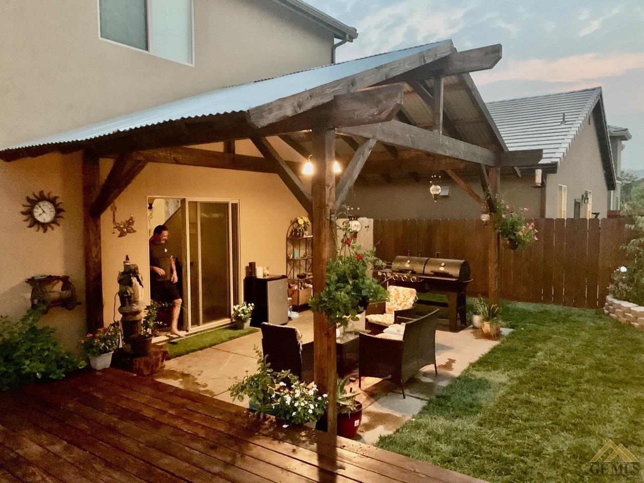 Undisclosed Address San Miguel, CA 93451 - Photo 11 of 12 a view of a porch with dining table and chairs with potted plants