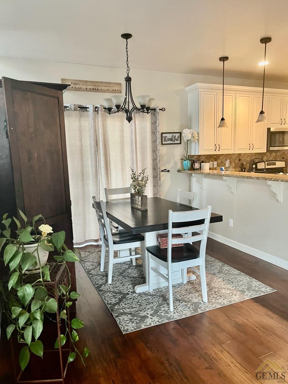 Undisclosed Address San Miguel, CA 93451 - Photo 5 of 12 a dining room with furniture potted plants and wooden floor