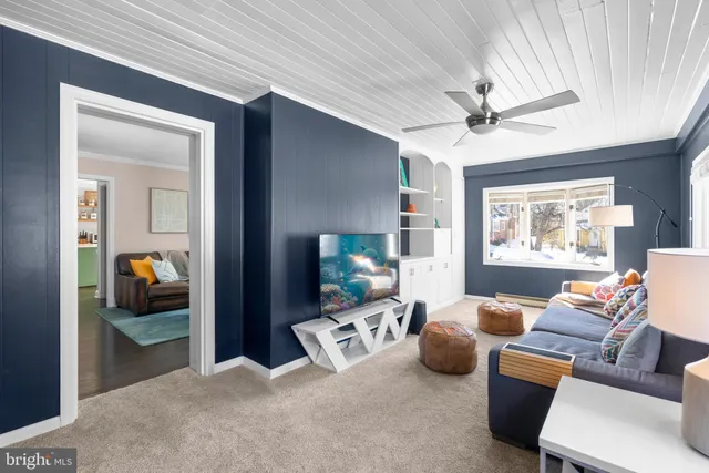 a bedroom with furniture and a mirror