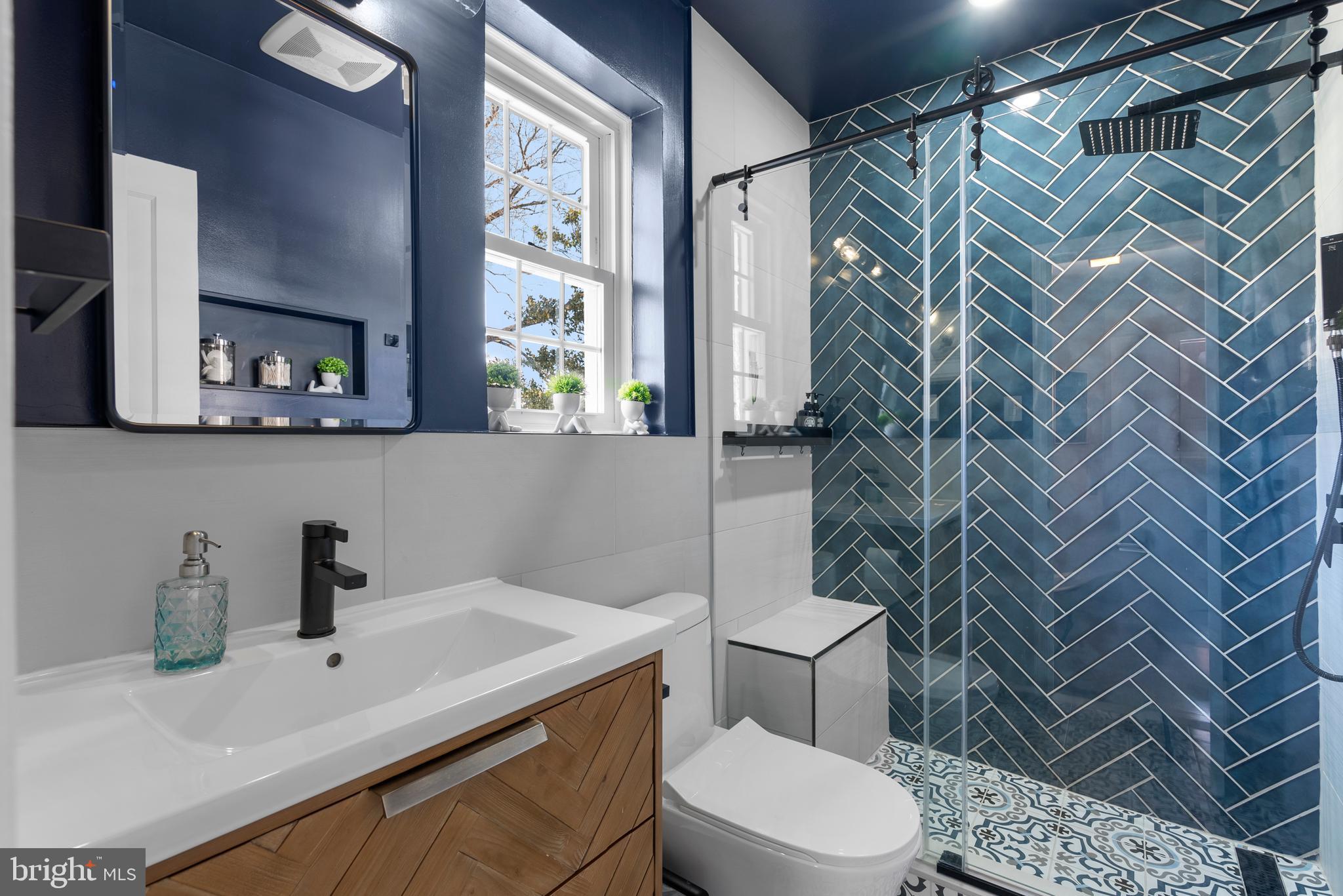 707 Forest Glen Road Silver Spring, MD 20901 - Photo 23 of 48 a bathroom with a sink toilet and shower