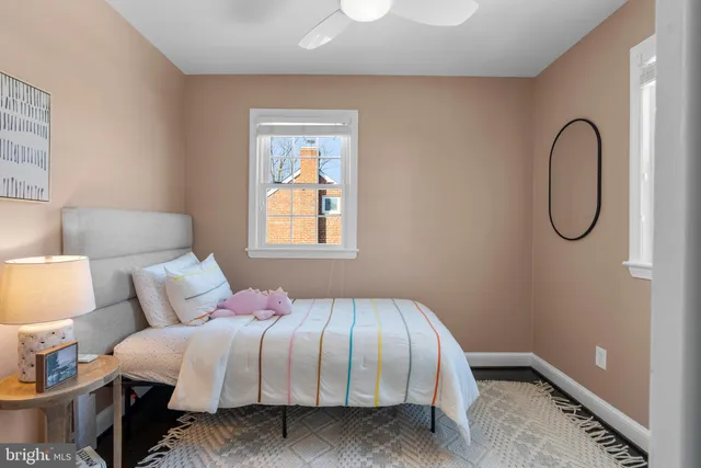 a bedroom with bed and a window