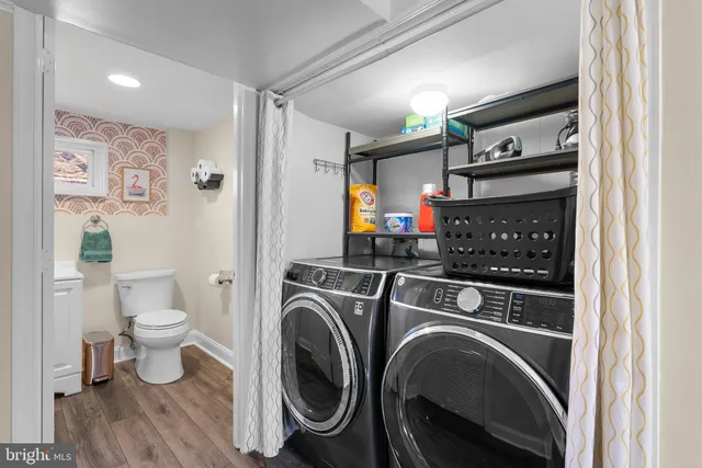 a view of bathroom with washer and dryer